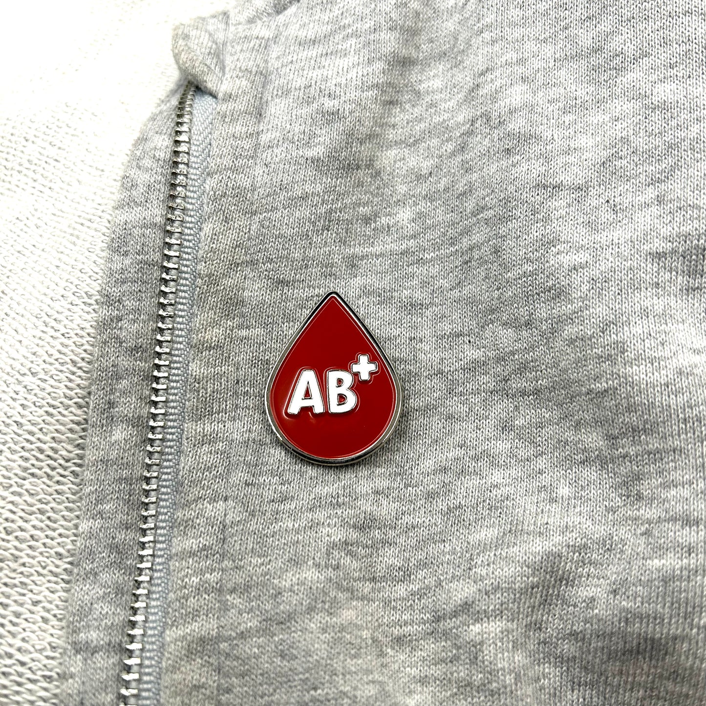 Pin del grupo sanguíneo AB+